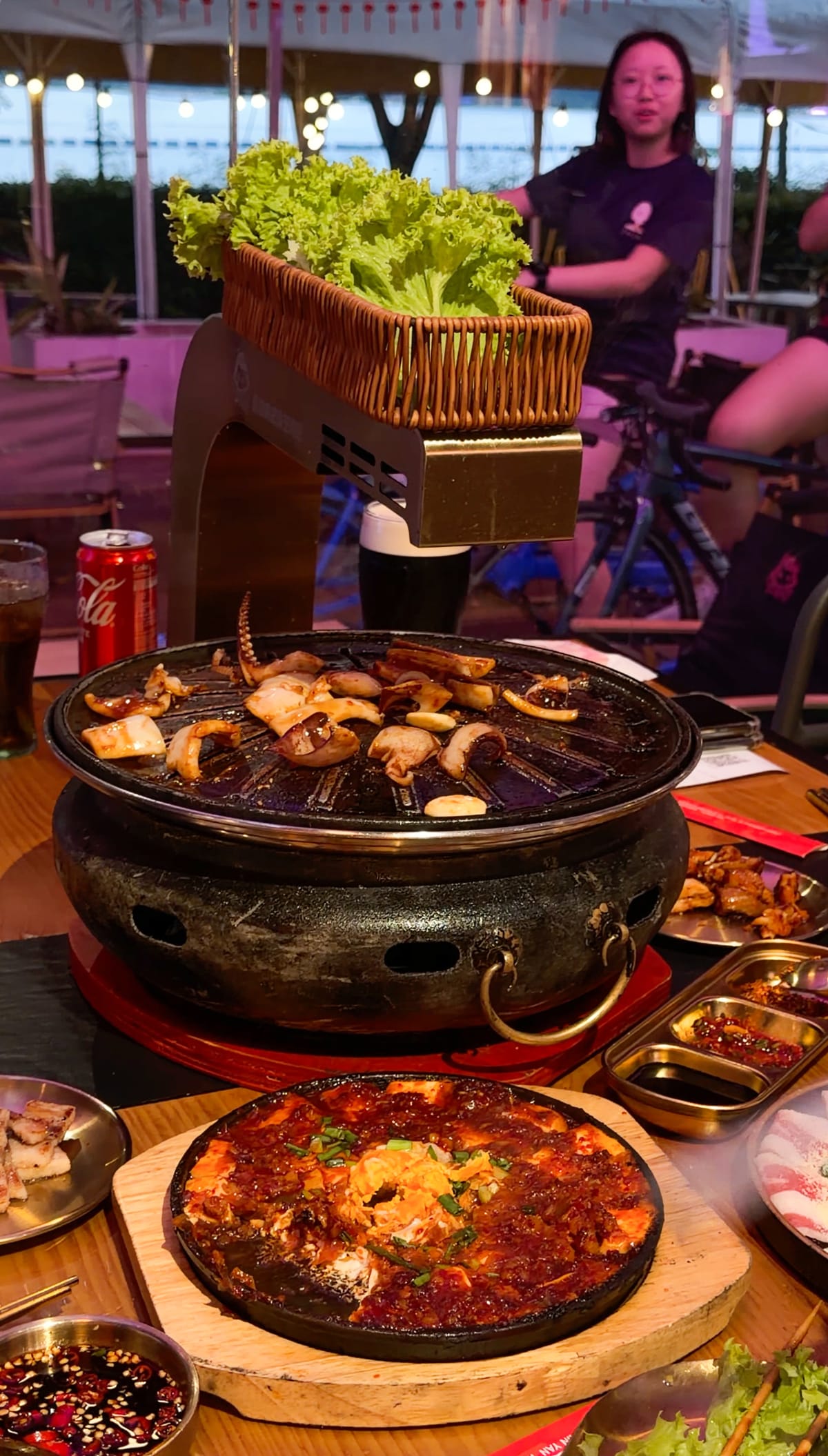 A spread of Korean BBQ and bubbling hotpot on the table