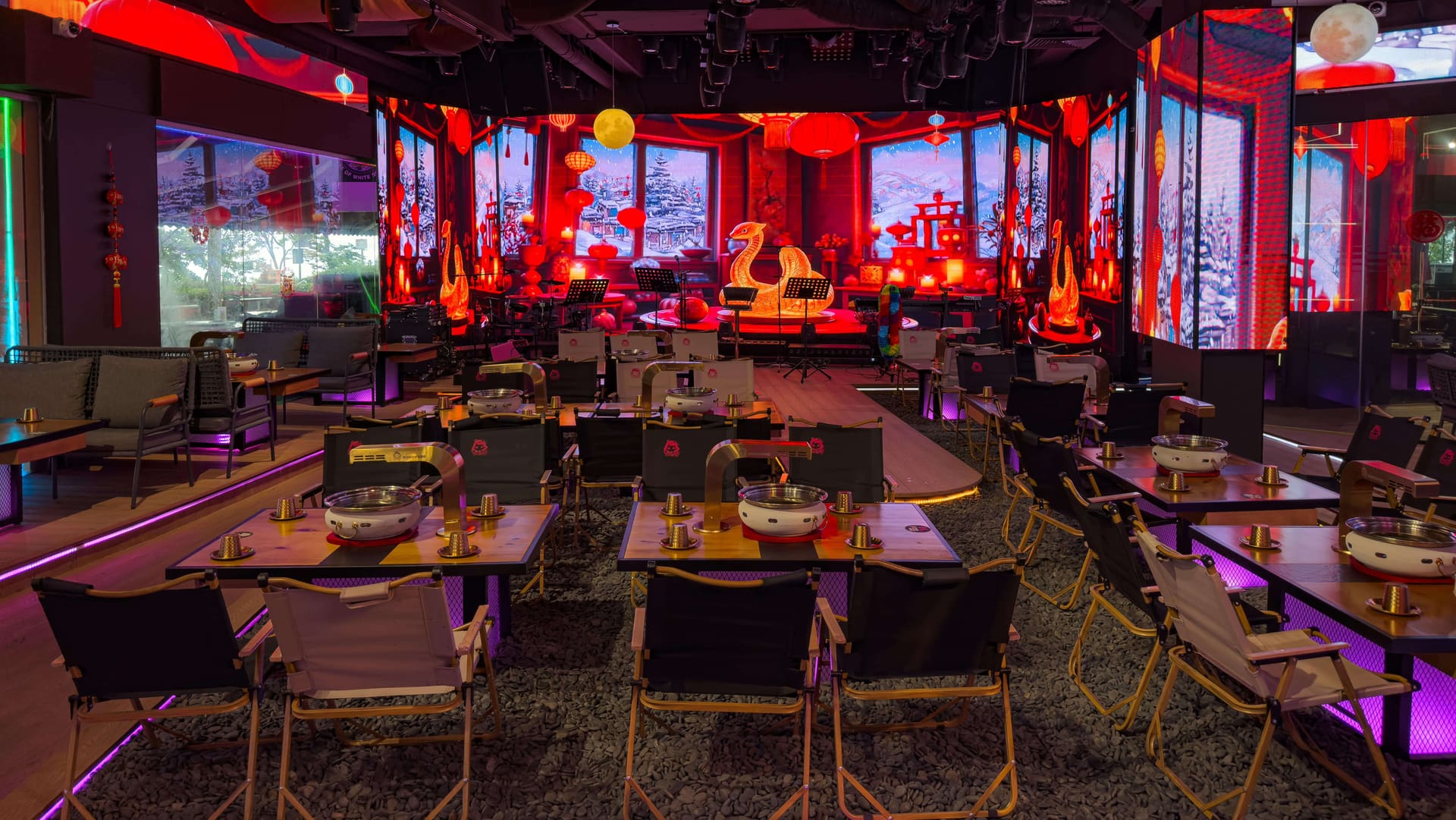 The vibrant dining room and live performance stage at Xin Yan Korean Live Show BBQ